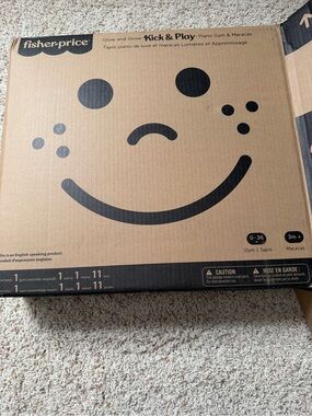 Fisher-Price Brown Cardboard Box with Black Smiley Face Packaging